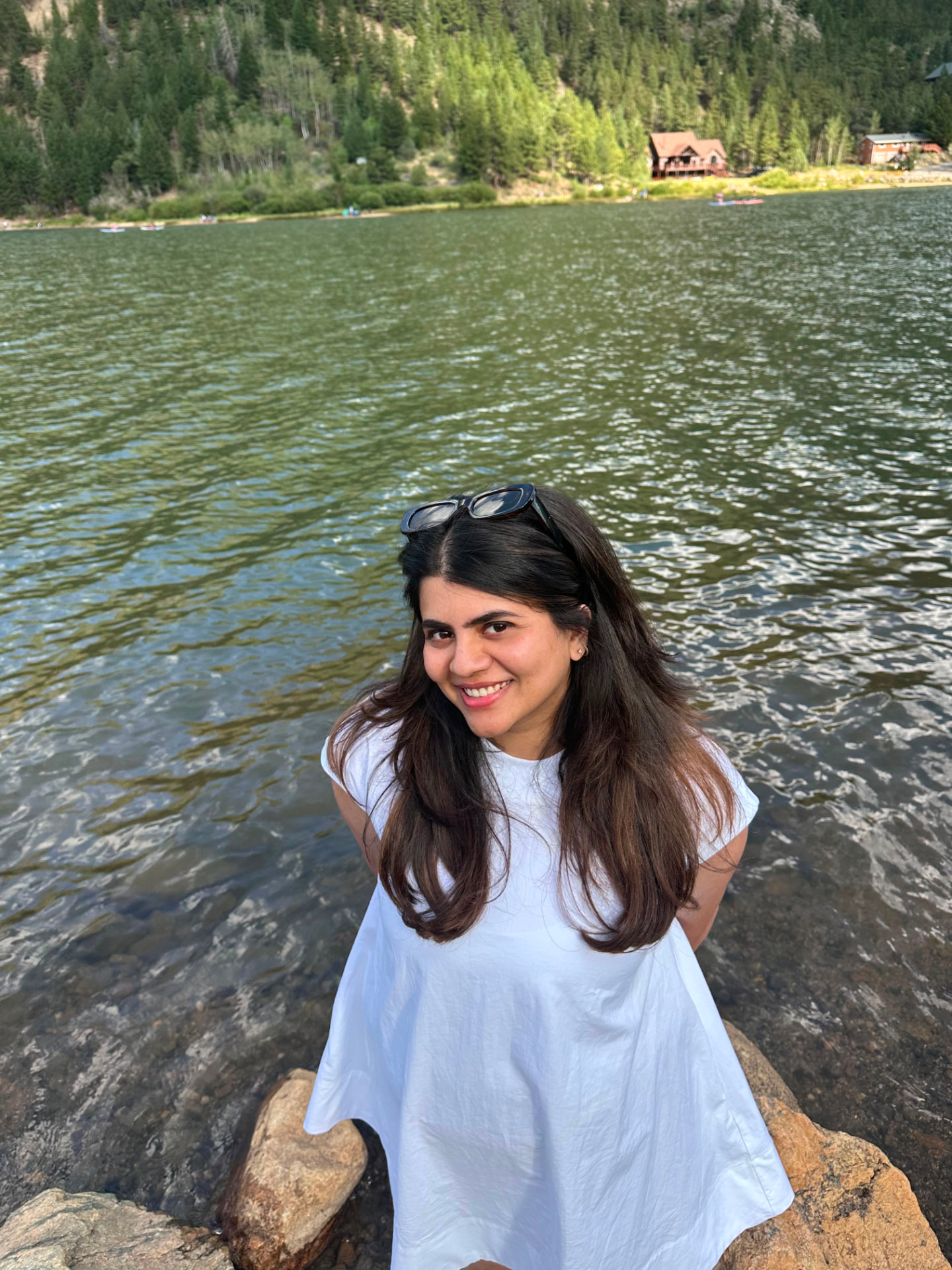 Devika Nhendanmadath, product leader, portrait by a mountain lake